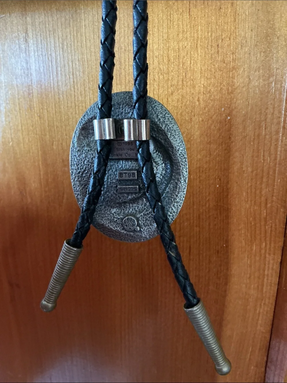 Siskiyou Buckle Co. pewter bolo tie with a braided cord and metal aglets